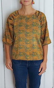 The gathered raglan sleeves top...